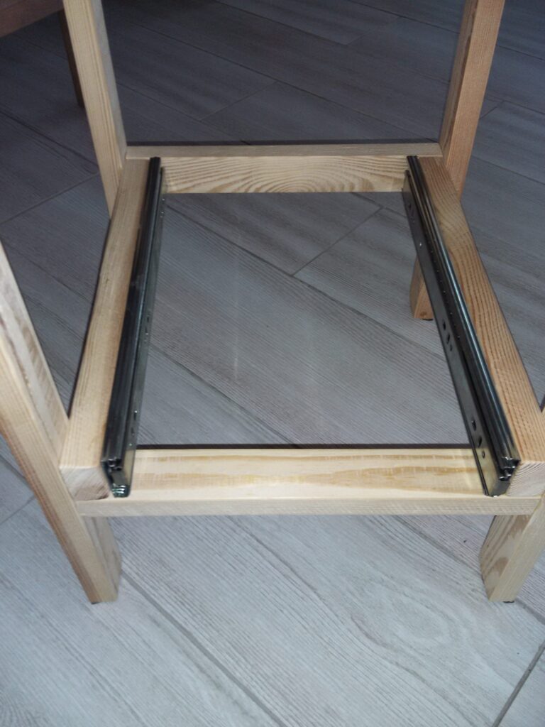 Attach the drawer slides to the stool