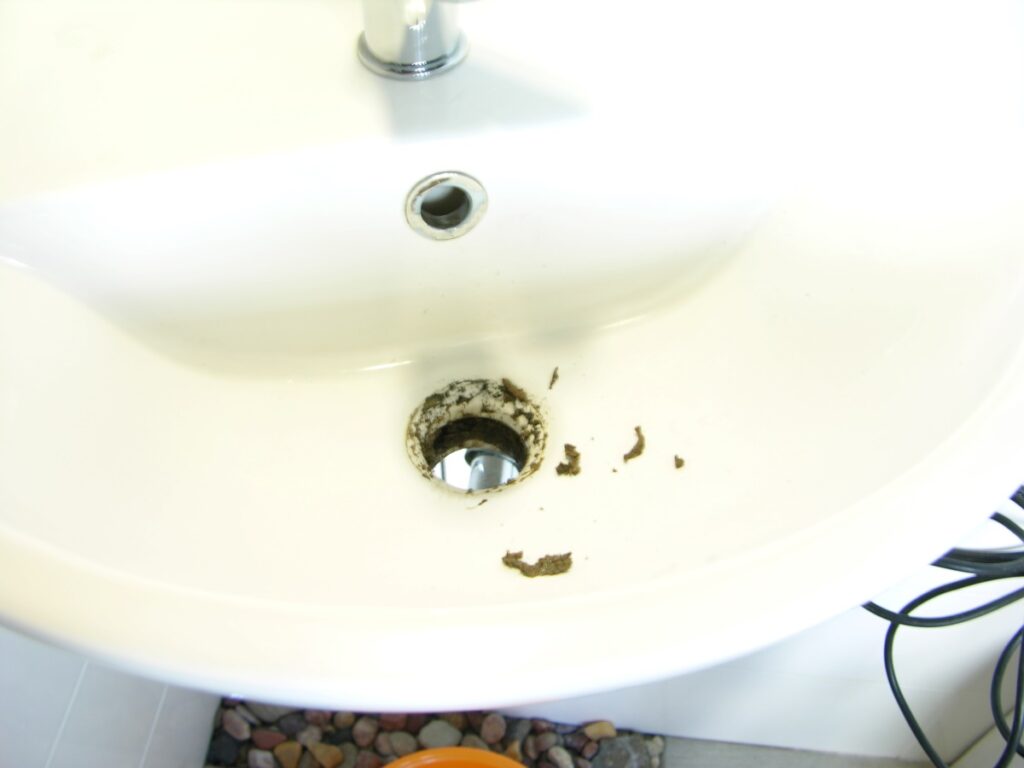 How to clean a sink overflow